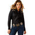 Woman wearing a black shirt with animal print accents and blue jeans on a white background