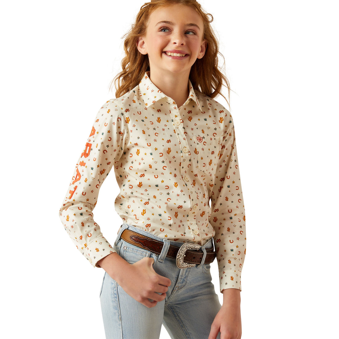 Young girl wearing a floral blouse and jeans on a white background
