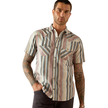 Man wearing a patterned shirt on a white background