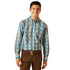 Man wearing a patterned shirt and brown pants on a white background